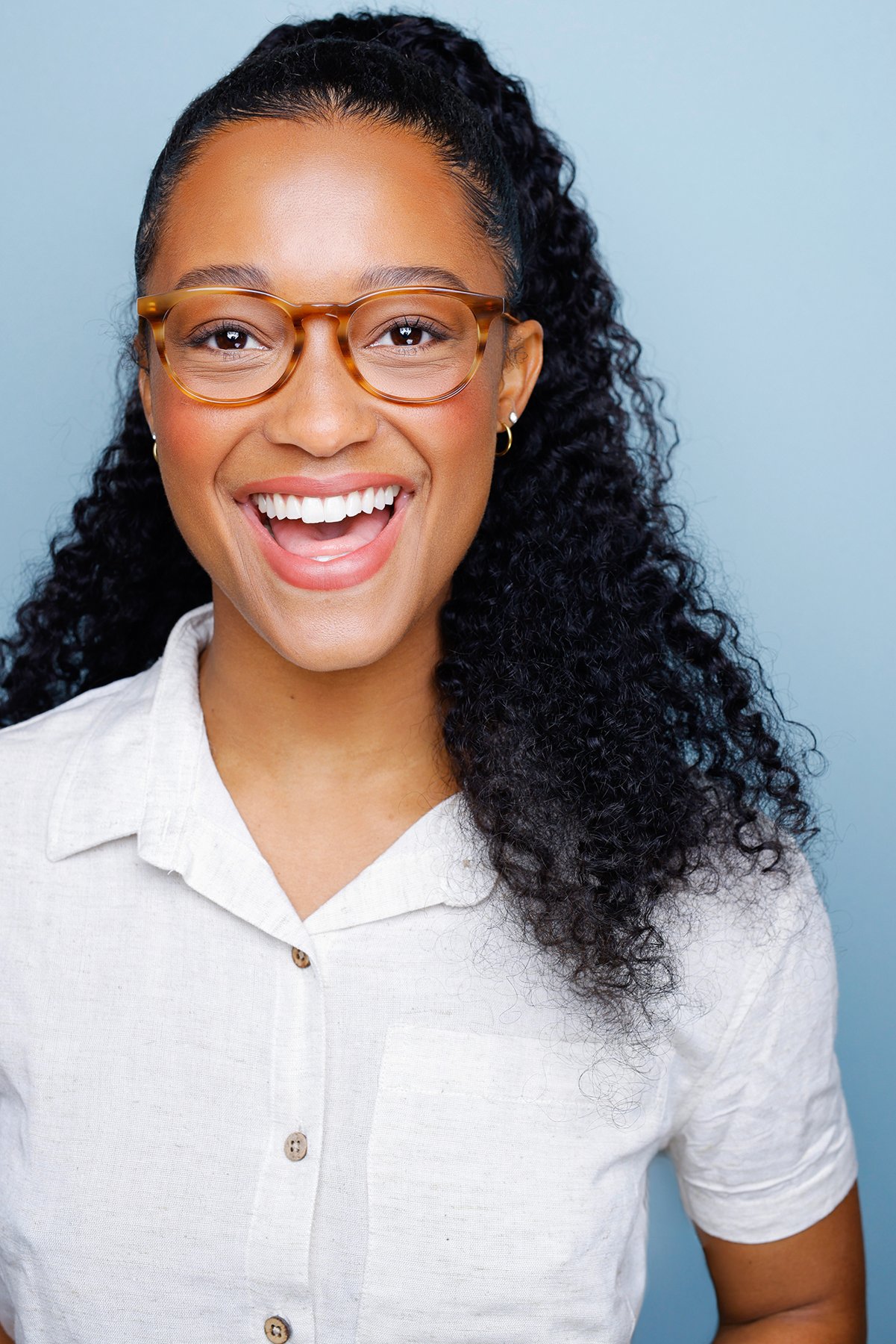 Tortoise glasses, laughing