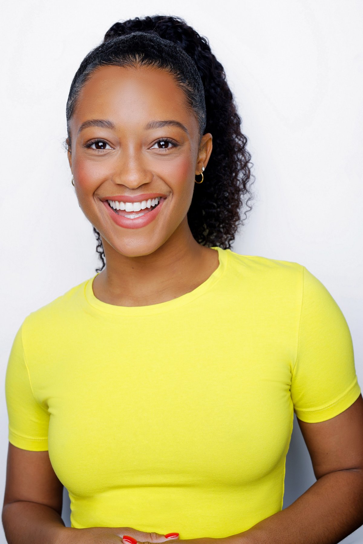 Yellow tee, smiling